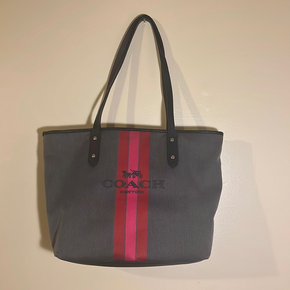 Gray coach bag purse with red and pink stripes.